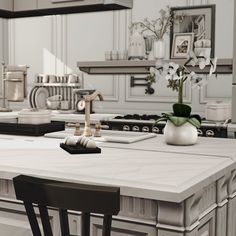 a kitchen with white counter tops and black chairs