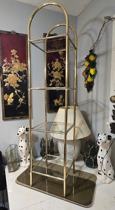 Vintage Brass and Glass Shelf. Stunning 4 Tier Brass Shelf with Clear Glass Panels and arched top. Definitely the Hollywood Regency Vibe. Universal appeal for nearly every room in your home. Approximately 56" tall x 12" x 12". In great vintage condition, some typical brass patina. One of the Glass pieces has one chip and on another glass it has some staining on it I can't get off. Also has a small dent, hardly noticeable.  please see photos. Costs reflects this.  No missing feet caps or glass pr Brass Plant Stand, Hollywood Room, Brass Shelf, Brass Shelves, Hollywood Regency Decor, Apartment Vibes, Floor Shelf, Shelf Furniture, Brass Patina