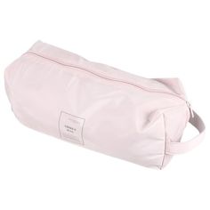 a pink toilet bag sitting on top of a white floor