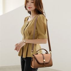 If you desire an eye-catching appeal during outings, then invest in this fashion-styled handbag for women that has a casual tote shape and a solid pattern. The soft-textured designer crossbody bag is made from high-quality syntehtic leather and a polyester lining. It's a dual-strapped bag with a zipper closure, several interior slots, and an exterior flap pocket. SpecificationsTypes of bags: Shoulder & Crossbody BagsStyle: FashionShape: Casual TotePlace Of Origin: HE BEI ProvincePlace Of Origin: HE BEI ProvincePattern Type: SolidOrigin: Mainland ChinaOccasion: VersatileNumber of Handles/Straps: TwoModel Number: Purses and HandbagsMain Material: Synthetic LeatherLining Material: PolyesterInterior: Interior Slot Pocket,Cell Phone Pocket,Interior Zipper Pocket,Interior CompartmentHardness: SO Spring Leather Satchel With Double Handle, Leather Satchel With Double Handle For Spring, Leather Top Handle Bag For Spring, Spring Leather Top Handle Bag, Trendy Brown Satchel With Double Handle, Trendy Brown Handheld Satchel, Single Shoulder Strap Bag For Daily Use In Fall, Spring Large Capacity Leather Satchel, Fall Single-shoulder Strap Bag For Daily Use