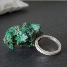 Ring with Raw malachite, this piece is unique since each stone is.  - It is a sterling silver ring with a big malachite rough head. - A Statement ring inspired by nature. - Organic ring especially for a woman. - A perfect gift for mineral lovers You must treat this stone delicately and not submerge it in water. Do not use chemicals wearing the ring I can make this ring with other raw stones. Ideal for a special occasion.  // All my pieces are designed and manufactured by hand in my workshop // Thank you for visiting my shop: https://www.TessJewelsDesign.etsy.com Follow me on my social networks: ** Instagram: https://www.instagram.com/tessjewels/ ** Pinterest:  https://www.pinterest.es/TessJewelsDesign/ Remember that we make tailor-made and personalized pieces, do not hesitate to ask us for Unique Chrysocolla Rings For Gift, Green Malachite Rings As A Gift, Unique Chrysocolla Rings As Gift, Silver Malachite Rings As Gift, Handmade Silver Malachite Rings, Big Cocktail, Raw Malachite, Malachite Ring, Big Stone Ring