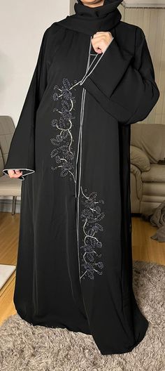 Dubai Abaya, partywear, eid special, Ramadan, gift for her, Nidaa material Abaya. Grey designs , saudi style, Arabic style, And with a bit of  creativity you can make it shine  for any ocassion. Avaiable in size 52, 54, 56,& 58 Eid Black Kaftan With Dabka Work, Black Kaftan With Dabka Work For Eid, Black Long Kaftan With Dabka Work, Black Dabka Work Kaftan For Eid, Black Embroidered Abaya For Wedding, Black Embroidered Wedding Abaya, Wedding Black Embroidered Abaya, Elegant Long Abaya With Dabka Work, Black Floor-length Abaya With Dabka Work