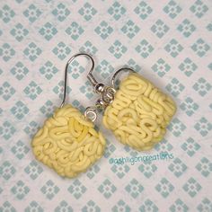 Ramen Earrings Noodles measure approximately between 1.5cm to 2.25cm Materials: ▫ Polymer Clay ▫ Hypoallergenic Hanging Earring Hook Each Ramen square is handmade by me, so you may receive a pair of earrings that are slightly different from the ones pictured in the listing. As they are all made by hand all are similar but no two pairs will ever be the same! I can also do custom orders. Please feel free to send me a message with any questions or ideas! Thanks for checking out my shop! Square Hypoallergenic Earrings For Gift, Hypoallergenic Square Earrings For Gifting, Hypoallergenic Square Earrings As Gift, Hypoallergenic Square Earrings For Gifts, Gift Earrings With Square Pendant For Pierced Ears, Gift Square Pendant Earrings For Pierced Ears, Square Pendant Earrings For Gift, Handmade Square Earrings For Gift, Handmade Yellow Rectangular Earrings