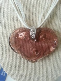 Now selling: Red Sparkly Blown Glass Heart Pendant Necklace with white hemp and lace cording https://www.etsy.com/listing/236662272/red-sparkly-blown-glass-heart-pendant?utm_campaign=crowdfire&utm_content=crowdfire&utm_medium=social&utm_source=pinterest Brown Heart Shaped Jewelry With Heart Beads, Brown Heart Pendant Necklace For Valentine's Day, Brown Heart-shaped Necklace For Valentine's Day, Brown Heart Necklace For Valentine's Day, Valentine's Day Heart-shaped Brown Necklace, Valentine's Day Brown Heart Necklace, Heart Necklace Red, Glass Heart Necklace, Red Gothic