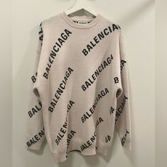 Balenciaga Light Beige And Black Round Neck Allover Logo Pullover Sweater In Size Small. Brand New, Never Worn. No Tags. Designer Crew Neck Sweater For Spring, Designer Long Sleeve Winter Sweatshirt, Designer Beige Long Sleeve Tops, Designer Long Sleeve Beige Tops, Designer White Sweater, Designer White Long Sleeve Sweater, Designer Long Sleeve Winter Sweater, Designer Letter Print Tops For Winter, Designer Oversized Tops For Winter