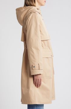 Classic trench detailing—including belted cuffs and gun flaps—brings a timeless look to this longline jacket topped with an adjustable hood. 39" length (size Medium) Front zip closure with snap storm placket Drawcord-toggle hood Belted cuffs Front snap-flap patch pockets Epaulets Gun flaps Storm flap Internal drawcord waist 100% polyester Machine wash, tumble dry Imported Winter Outerwear With Flap Pockets In Gabardine, Classic Hooded Parka With Pockets, Spring Workwear Parka With Adjustable Hood, Classic Fall Parka With Detachable Hood, Classic Parka With Detachable Hood For Fall, Spring Workwear Parka With Detachable Hood, Workwear Parka With Detachable Hood, Helmut Lang Jeans, Rain Outfit