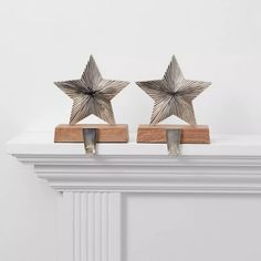 two metal stars are placed on the mantle