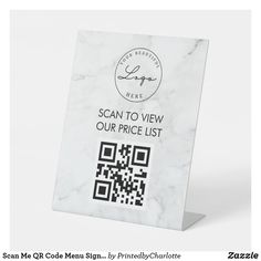 a white marble sign with the text scan to view our price list and qr code