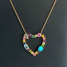 14kt Gold Diamond & Multi-Gemstone Open Heart Necklace Beautiful Multi-Shaped Gemstones Including Diamonds, Sapphires, Rubies, Emeralds, Moonstone, Aquamarine, And Turquoise Are Prong Set In 14kt Gold. On An Adjustable 15-17 Inch 14kt Gold Chain With Lobster Clasp Stamped 14kt - Heart Is 1 X 1 Inches Yellow Gold Gemstone Heart Necklace For Anniversary, 14k Gold Heart Necklace With Gemstone, Yellow Gold Heart Necklace With Gemstone, Anniversary Yellow Gold Heart Necklace With Gemstone, Yellow Gold Gemstone Heart Necklace In Sterling Silver, 14k Gold Heart Cut Gemstone Necklace, Yellow Gold Heart Cut Gemstone Necklace, Elegant Multi-stone Heart Cut Jewelry, 14k Yellow Gold Heart Necklace With Gemstone