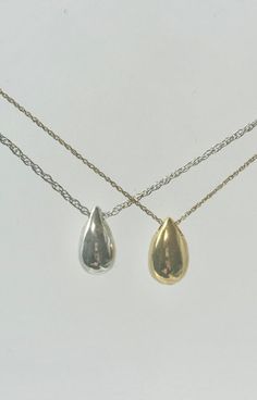 This beautiful mini teardrop pendant is a unique way to hold a loved one close. This pendant can hold a small amount of cremains, lock of hair, or dirt from the sacred burial grounds. This piece comes on an 18" matching chain.  size 1/2 inch engraving is ♥we are able to engraving up to 3 letters 2 sides ♥Engraving can be done in block or script font and in uppercase or lowercase as well as numbers GOOD TO KNOW: ♥ Available in 14k plated gold or a Sterling Silver ♥THIS PENDANT CAN BE ENGRAVED-SEE Classic Pear Shaped Drop Gift, Classic Pear-shaped Drop Gift, Classic Drop Earrings With Polished Finish For Gift, Dainty Teardrop Pendant Drop Necklace For Everyday, Dainty Teardrop Drop Necklace For Everyday, Dainty Teardrop Necklace For Everyday, Minimalist Hypoallergenic Teardrop Pendant Necklace, Minimalist Drop Necklaces For Anniversary, Classic Teardrop Drop With Polished Finish