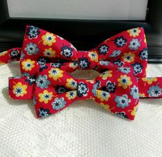 "Floral Matching Bow Tie Set is a Custom Bow Tie and Fully lined handmade. The Bow Ties are great gifts and make for beautiful holiday pictures and outfits. This Bow Ties are perfect for your little one to wear and match his daddy on that special event or for that special family picture. Please Note: The price is $28.99 for the set of Bow Ties. Please select sizes when ordering. Bow Ties are made out of 100% Cotton Fabric Fully lined and they measure approximately: Men's 5\" by 21/2\" Tall and a Multicolor Bow Tie For Summer Gift, Red Bow Tie As A Gift, Red Standard Tie Bow As Gift, Adjustable Red Bow Tie Suit Accessories, Adjustable Red Bow With Ties, Satin Bow Tie As Summer Gift, Red Bow Tie With Butterfly Knot For Gift, Red Bow Tie Back Bow As Gift, Red Bow With Bow Tie Back For Gift