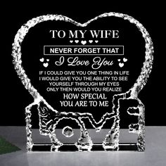 a glass heart shaped award with the words to my wife never forget that i love you