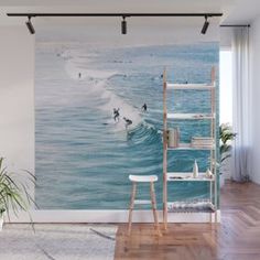 an ocean scene with waves crashing on the beach wall mural