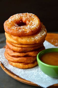 a stack of doughnuts sitting on top of a plate