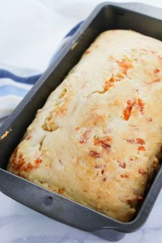 a loaf of bread sitting in a pan on top of a table