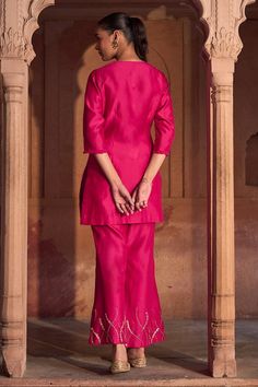 Fuchsia pink three fourth sleeves short kurta with petal swirl embroidery using cut dana, sequins highlights and frilled V neckline. Paired with an embellished border straight pant and scallop border peach dupatta. - Aza Fashions Festive Fitted Sets With 3/4 Sleeve, Traditional Fitted Pink Bottoms, Fitted Traditional Pink Bottoms, Pink Fitted Traditional Bottoms, Fitted Pink Silk Palazzo Set, Festive Pink Set With Set-in Sleeves, Fitted Pink Palazzo Set, Fitted Palazzo Set With Set-in Sleeves, Fitted Embellished Pink Kurta