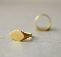 Gold signet ring, hand made of brass and gold plated in 22k gold size of this ring is 6 (US size) if you need different size let me know, I'll be happy to make you a custom order. it can take 7-14 days to be made can also be made in 14k/18k/22k solid gold, for prices convo me similar ring available in 14k gold: https://www.etsy.com/il-en/listing/161747210/antique-gold-ring-14k-gold-ring-signet?ref=shop_home_active_23 and in sterling silver: https://www.etsy.com/il-en/listing/168485588/silver-twi Matte Gold Brass Rings As Gifts, Matte Gold Brass Rings For Gift, Gold Brass Engraved Ring For Promise, Matte Gold 14k Gold Rings For Gift, Matte Gold 14k Rings For Gifts, Hand Forged Gold Signet Ring In Recycled Gold, Brass Rings With Polished Finish For Wedding, Hand Forged Yellow Gold Signet Ring In Brass, Matte Gold Open Ring Perfect As A Gift