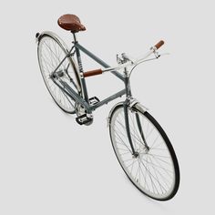 a blue bicycle with brown seat on white background