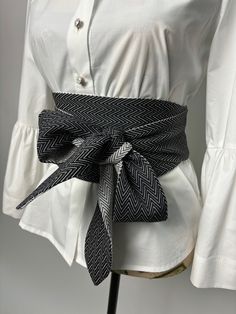 Double sided wide belt in black and black with white. The belt is suitable for long and medium length shirts, dresses and tunics. Goes great with a skirt or pants. It is made in several sizes. Size is determined by waist circumference. A great addition to your look. We produce quality garments for sustainable fashion.  Join our audience for special discounts with promo codes.  Copy the link below into your browser and confirm your subscription from the email you will receive.  https://mailchi.mp Spring Black Belted Corset Belt, Chic White Belt For Spring, Black Corset Belt For Spring, White Fabric Belt For Summer, Chic Spring Belts With Sashes, Black Fabric Belt For Summer, Chic Black Belts For Spring, Women's Belt, Cloth Belt