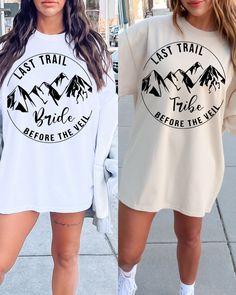 Introducing the "Last Trail Before The Veil" Bachelorette Party Shirts – a perfect blend of adventure and celebration for brides and their tribes who are ready to embark on a memorable journey in the breathtaking Rocky Mountains. For the bride herself, the shirt is a pristine white canvas adorned with elegant black writing. The words "Last Trail Before The Veil" take center stage, capturing the essence of both the upcoming wedding and the exciting outdoor adventure that awaits. This design is n Veil Bachelorette Party, Last Trail Before The Veil, Brides Sister, Tan Shirt, Bride Sweatshirt, Sister Outfits, Black Writing, Mountain Shirt, Black Bride