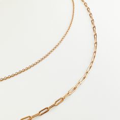 The Natasha Layered Chain Necklace is the perfect accessory for effortless layering. Featuring a two-row chain, this necklace is both understated and stylish. Simple and elegant, it provides a subtle yet refined touch to any look. Material: gold vermeil Length: shorter chain: 13.4"/340mm; longer chain: 15.4"/390mm; chain extender 2"/50mm Elegant Double Chain Link Layered Necklace, Minimalist Double Chain Yellow Gold Necklace, Minimalist Double Strand Layered Necklace, Minimalist Double Chain Link Necklace, Minimalist Multi-strand Chain Necklace, Minimalist Rose Gold Chain Necklace For Layering, Minimalist Layered Link Chain Necklace, Delicate Rose Gold Chain Necklace For Layering, Minimalist Everyday Layered Necklace With Gold Chain