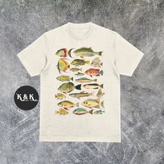 Vintage 90s Fish Shirt ⭐ Welcome to K & K Custom Tees! ⭐  - Indulge in pure comfort with our Comfort Colors Shirt. Soft, relaxed, and available in a variety of colors! ⭐SHIRT DETAILS⭐  -High Quality fabric  -100% ring-spun US cotton -Designed and printed in the USA  ⭐ PLEASE NOTE ⭐ -For an oversized look, we suggest to size up 1-2 sizes. These shirts run like standard unisex tees. Please see size chart for a more fitted look!  -Colors may vary based on your monitor or screen display! ⭐CARE INSTR Graphic Print Shirt For Fishing In Summer, Short Sleeve Fish Print T-shirt For Fishing, Fish Print Crew Neck Top For Fishing, Cotton Tops With Fish Print For Fishing, Fish Shirt, Vintage Graphic Tees, Graphic Tees Vintage, Fishing T Shirts, Vintage Graphic