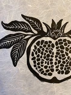 a drawing of a pomegranate with leaves on it