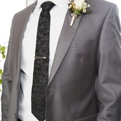 It's a throwback to the days of reading comics with our Batman Comic Black Tie, featuring a comic book pattern woven in a black-on-black tonal design. This necktie has a bit more character than your typical "black tie", but the pattern is subtle enough to remain coyly professional for formal events and weddings. Our tie will maintain its shape and hold a sturdy knot thanks to the durable yet stylish 100% Polyester. Officially licensed by DC Comics. Black Fitted Suit And Tie Accessories For Father's Day, Classic Black Ties For Groom, Black Tie Accessories For Groom, Harry Potter Tie, Scarf Storage, Designer Cufflinks, Book Pattern, Black Spiderman, Boys Bow Ties