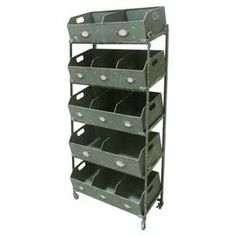 a metal shelf with six bins on it and four shelves in the bottom half