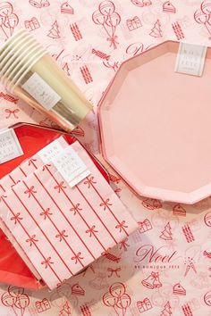 pink and white plates with tags on them