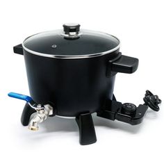 a black pot with a blue handle is sitting on a white surface