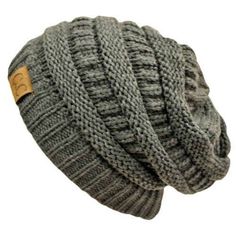 a green knitted beanie hat with a wooden button on the front and side