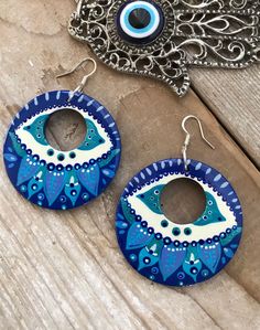 Handpainted Wood Earrings in azure blues . Evil eye inspired , these one of a kind earrings are painted in acrylics and sealed with an Artist grade non yellowing gloss to protect the artwork . Painted Earrings, Polymer Crafts, Colorful Earrings, Azure Blue, Earrings Boho, Great Christmas Gifts, Round Earrings, Boho Earrings