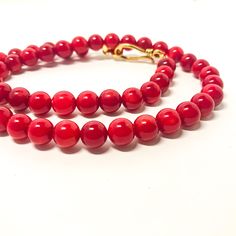 This pretty coral beads necklace is made with natural coral beads.  Each bead is unique with various shades of red. You will see some roughness and imperfection, but overall, they are shiny and luster. Material: Red coral beads (color enhanced) Beads size: 9mm-10mm Color: Red Length: 18 inches. 20 inches, 22 inches, 24 inches Closure:  Gold plated S hook. Let me know if you want different length of this necklace. It may take 2-3 days to make it. Elegant Coral Round Bead Necklaces, Elegant Red Coral Gemstone Beads, Elegant Hand-strung Coral Necklaces, Elegant Coral Hand-strung Necklaces, Elegant Coral Beaded Necklaces, Elegant Hand-strung Coral Necklace, Elegant Hand-strung Red Beaded Necklaces, Elegant Red Hand-strung Beaded Necklaces, Elegant Red Coral Necklaces With Polished Beads