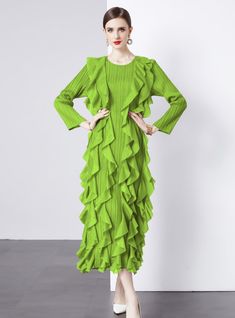 Emanate a vibrant energy in this striking green ruffle dress, a bold statement piece designed for the fearless fashion enthusiast. With its electrifying hue, this dress is a wearable expression of confidence and individuality. The unique pleated texture, combined with the cascading ruffles from the waist down, creates a sense of dynamic movement, echoing the rhythm of the wearer's stride. The elongated cuffs and structured shoulders craft a silhouette that's both modern and timeless. It's an ide Dark Green Evening Dress For Spring, Dark Green Spring Party Midi Dress, Dark Green Midi Dress For Spring Party, Chic Dark Green Midi Dress For Spring, Elegant Kelly Green Spring Dresses, Elegant Kelly Green Dresses For Spring, Summer Party Dark Green Midi Dress, Spring Dark Green Midi Dress, Green Pleated Party Dress