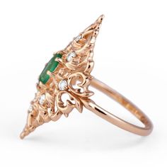 Feel free to contact us to make a custom order inquiry. Emerald Ring with diamonds is a beautiful creation in Yellow Gold embellished with classical ornamental leaves design, accented with Natural Zambian Faceted Emerald and White Diamonds. Materials: 14K Yellow Gold, 0.5ct Natural Faceted Emerald, 8 White Natural Diamonds totaling .24cts. Available in 14K and 18K Yellow Gold Emerald Ring With Diamonds, Gold Infinity Ring, Emerald Ring Vintage, Green Gemstone Ring, Natural Emerald Rings, Green Emerald Ring, Emerald Diamond Ring, Leaves Design, Gold Cocktail