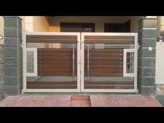 an entrance to a house with wooden doors