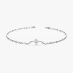 Amy Embrace a touch of timeless elegance and subtle sparkle with this Minimalist Natural Diamond Clover Bracelet. This captivating bracelet is crafted from high-quality 14k gold (available in yellow, rose, or white gold) and features a dainty four-leaf clover charm. Four sparkling diamond bezels adorn the clover, symbolizing luck and prosperity. The intricate design creates a touch of shimmer, making this bracelet a perfect everyday accessory or a meaningful addition to a layered look. - Handmad White Gold Diamond Bracelets, Tarnish Resistant, Tarnish Resistant White Gold Diamond Bracelet In Sterling Silver, White Gold Minimalist Chain Bracelet For Formal Occasions, Tarnish Resistant White Gold Diamond Bracelet, Classic Formal Bracelet With Delicate Chain, Tarnish-resistant White Gold Sterling Silver Diamond Bracelet, Classic Formal Bracelets With Delicate Chain, Classic Delicate Chain Bracelet For Formal Occasions, Formal Minimalist White Gold Chain Bracelet