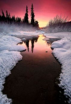 a river that has some snow on it