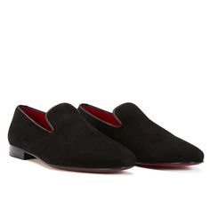 This plush black version of the timeless 'loafer' has been hand crafted from flawless suede leather, embellished with a leather insole that nods to the brand's heritage. Perfectly paired with a tailored suits, leather jackets or a tuxedo on a red carpet. Stacked heel. Leather Lining for a luxurious feel and moisture control Leather sole Tapered round toe. Slip-on style. The handmade leather outsole and insole are Made in Italy. STYLE #32399 Formal Slip-on Loafers With Red Sole, Formal Slip-on Loafers With Suede Lining, Black Suede Slip-ons For Business, Black Slip-on Suede Dress Shoes, Classic Slip-on Loafers With Red Sole, Business Black Suede Loafers, Luxury Black Tassel Loafers With Leather Sole, Classic Formal Slippers With Almond Toe, Black Suede-lined Business Dress Shoes