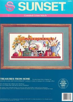 the cross stitch book features an image of a table with dishes and vases on it