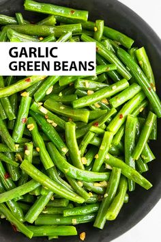 garlic green beans in a black bowl with the words garlic green beans on top and bottom