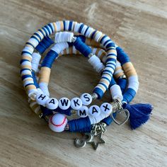 two bracelets with charms and letters on them