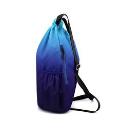 a blue and purple backpack with black straps on the bottom, sitting against a white background