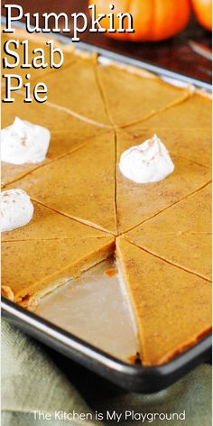 the pumpkin slab pie is ready to be baked in the oven and served with whipped cream