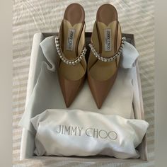 Gorgeous Jimmy Choo Nude Heels With Rhinestone Strap. Great Condition!! Some Scuffs On The Underside As Expected But Nearly Pristine Otherwise! Comes With Dust Bag And Original Box Nude Heels, Jimmy Choo Shoes, Shoe Box, Jimmy Choo, Shoes Women Heels, Original Box, Dust Bag, Shoes Heels, Women Shoes