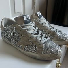 Superstar Golden Goose Suede Glitter Low Top Sneakers 39eu/Size 9 In Great Condition, Have Only Been Worn 5 Times. Silver High-top Sneakers With Glitter Accents, Metallic Low-top Sneakers With Glitter Accents, Silver Glitter Print Lace-up Sneakers, Silver Sneakers With Glitter Print And Round Toe, Silver Glitter Print Sneakers With Round Toe, Casual Silver Sparkling Sneakers, Silver Glitter Lace-up Sneakers, Silver Sparkling Sneakers With Round Toe, Silver Sparkling Lace-up Sneakers