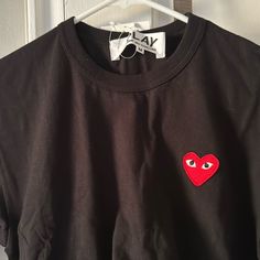 Brand New Comme Des Garon Tee With Tags Black Long Sleeve T-shirt With Heart Graphic, Black Long Sleeve Tops With Heart Graphic, Black Long Sleeve Top With Heart Graphic, Cotton Crew Neck Shirt With Heart Graphic, Black Tops With Heart Graphic And Short Sleeves, Black Short Sleeve Top With Heart Graphic, Black Cotton Top With Heart Graphic, Black Graphic Tee Shirt With Heart Design, Black Graphic Tee Shirt With Heart Graphic