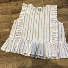 This Super Cute Top With Blue Vertical Strips And Ruffin Details Would Look So Cute With Denim Or White Denim Shorts Light Wash Cotton Tops For Brunch, White Denim Casual Tops, Spring White Denim Top, White Denim Tops For Spring, White Denim Top For Day Out, Chic White Denim Tops, Striped Cotton Tops For Brunch, Cotton Striped Tops For Brunch, Creme White