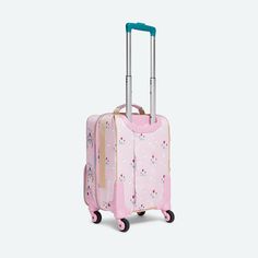 a pink suitcase with blue handles and handle on wheels, sitting against a white background